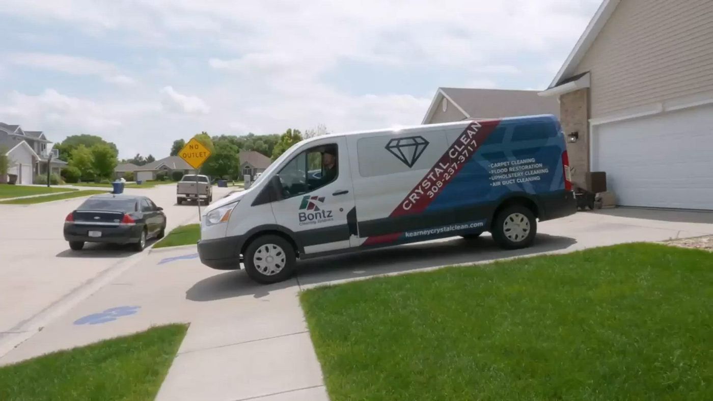 Crystal Clean Carpet Care service van parked outside a Kearney home